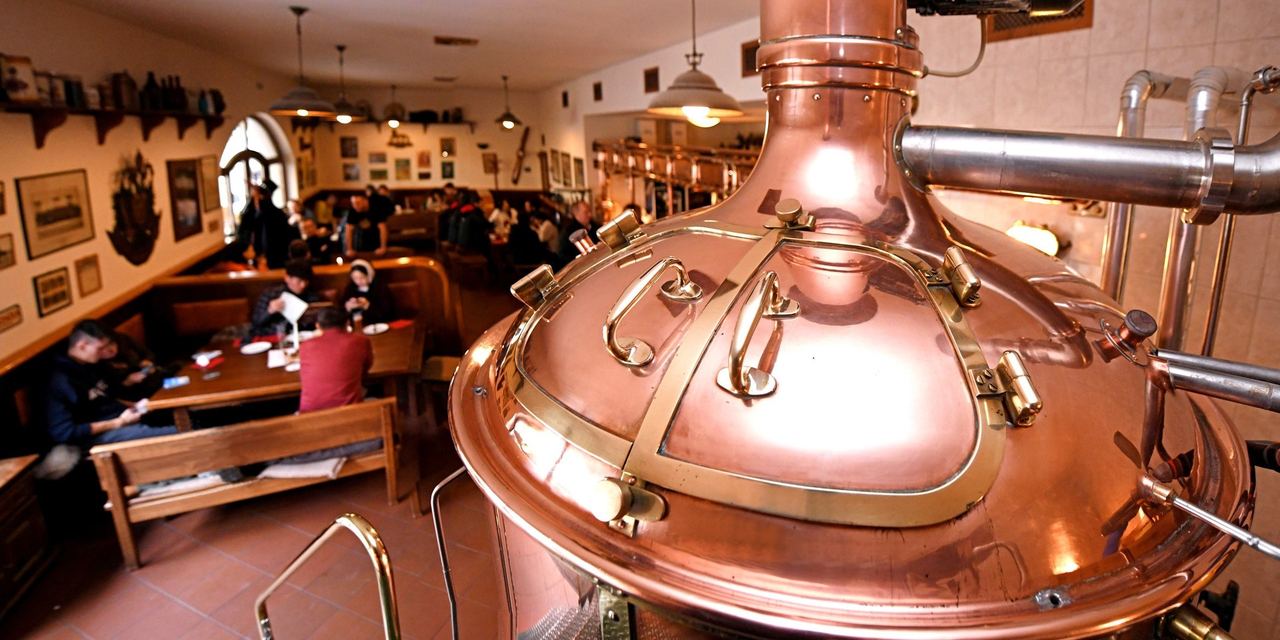 The copper brew kettle beside the beer hall of the Strahov Monastic Brewery